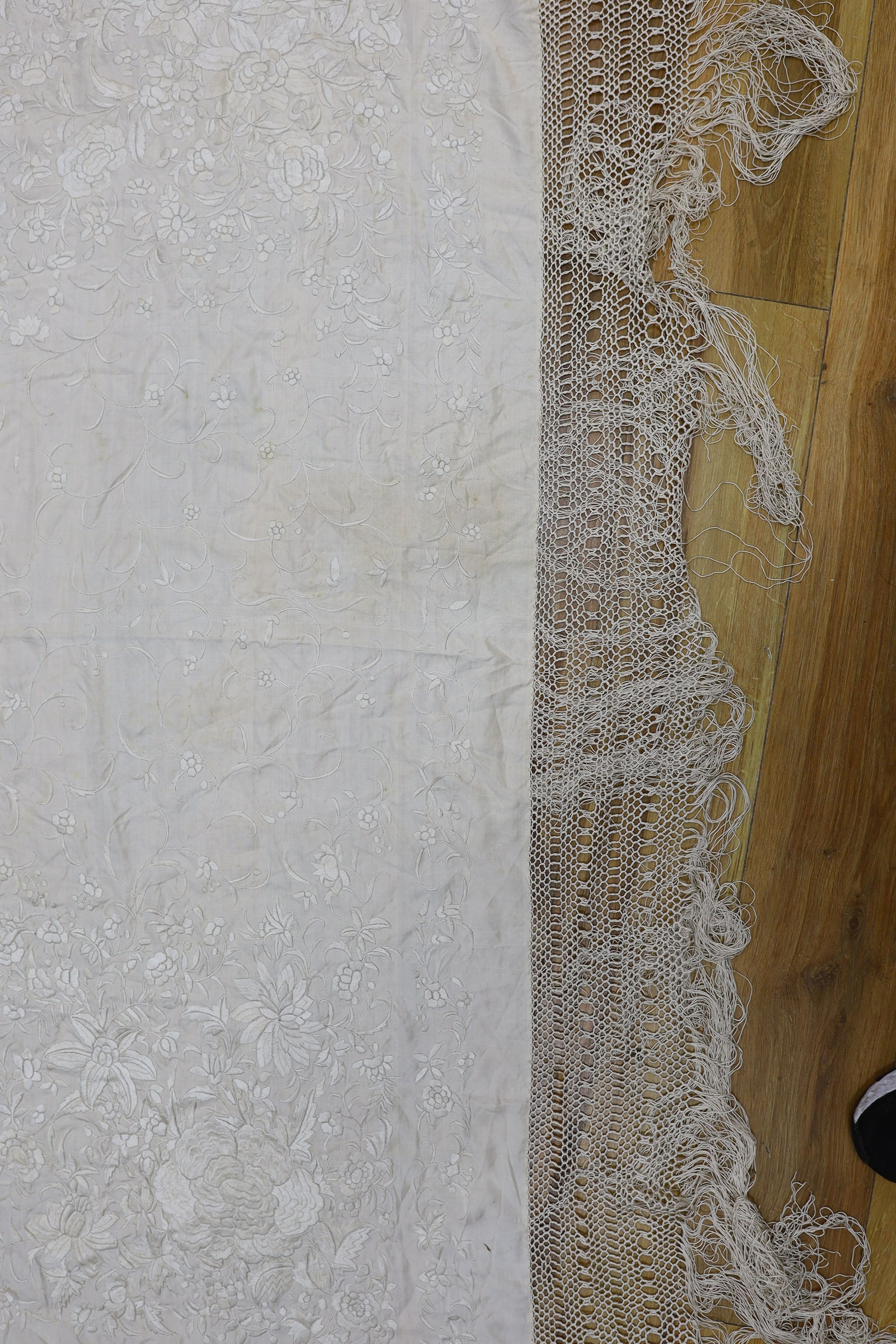 A 19th century cream embroidery on cream silk shawl together with a smaller later shawl